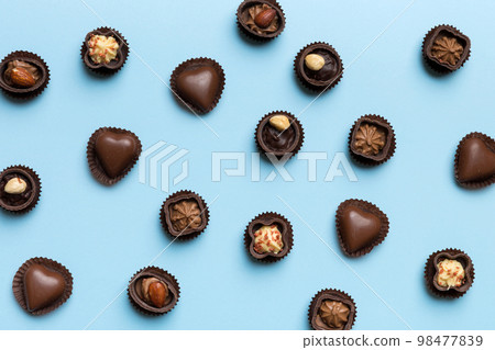Different kinds of chocolates on colored table close-up. Top View and Flat Lay 98477839