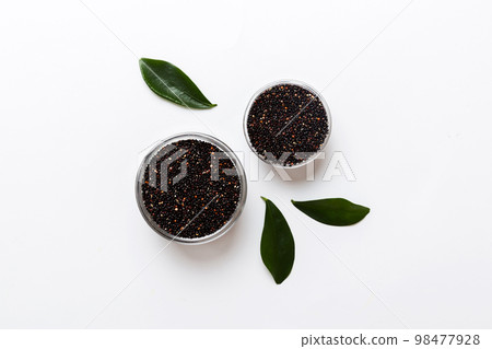 quinoa seeds in bowl on colored background. Healthy kinwa in small bowl. Healthy superfood 98477928