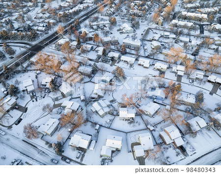 winter sunrise over residential area of Fort Collins covered by snow in northern Colorado, aerial view winter sunrise over residential area of Fort Collins covered by snow in northern Colorado, aerial view 98480343