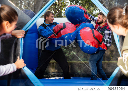 Two men having funny battle 98483064