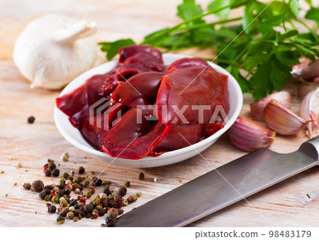 Raw rabbit liver on wooden table 98483179