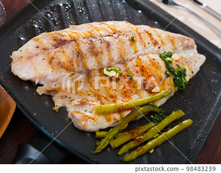 Roasted in oil sea bass slices 98483239