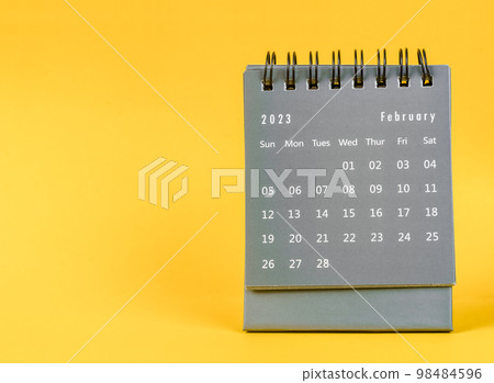 The February 2023 desk calendar for 2023 year on yellow color background. The February 2023 desk calendar for 2023 year on yellow color background. 98484596