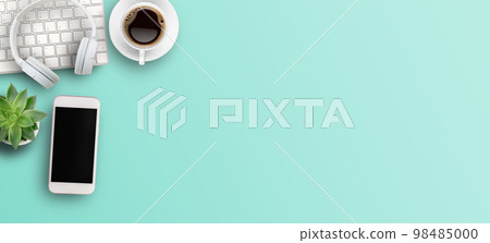 Top view with call center desktop,headset,smartphone and accessories on green background. Top view with call center desktop,headset,smartphone and accessories on green background. 98485000