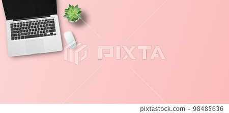 Top view with call center desktop, headset and accessories on pink table background. Top view with call center desktop, headset and accessories on pink table background. 98485636