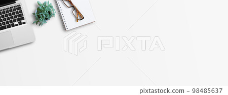 Office desk top view with stationary on white background 98485637