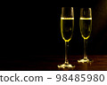 Champagne with party concept, Glass of champagne on wooden table over black background 98485980