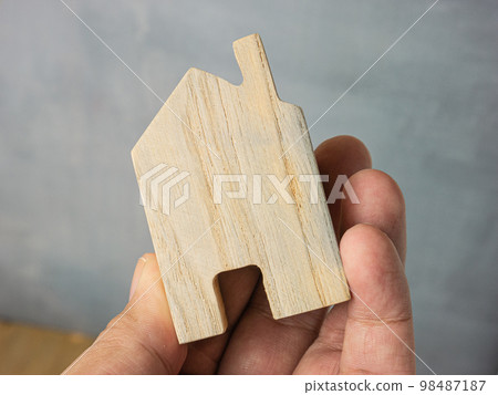 The wood home for building or property concept. The wood home for building or property concept. 98487187