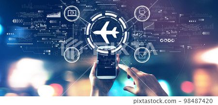 Flight ticket booking concept with city lights at night Flight ticket booking concept with city lights at night 98487420