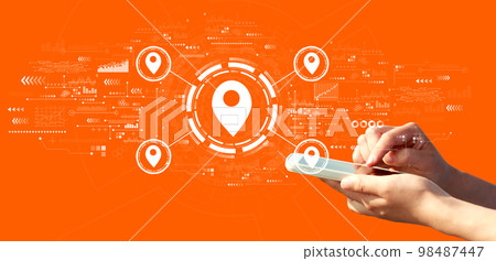 Map pin concept with person using a smartphone Map pin concept with person using a smartphone 98487447