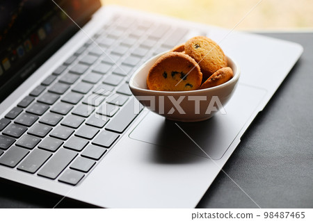 internet cookies internet browser cookies concept, mini cookies on keyboard computer laptop 98487465