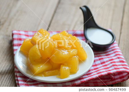 cassava food on the table food, sweet dessert made of boiled cassava, sugar and coconut milik - Thai food dessert 98487499