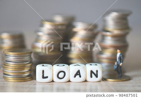 Loan business economy concept of money and finance on table, Loan business finance economy and business man standing on a coin on wooden table background 98487501