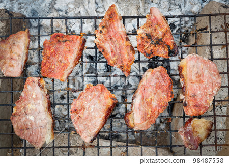 Grilled pork steaks, pork neck with salt on the grill nature local food rural asia, Grilled meat bbq barbecue pork roast street food 98487558