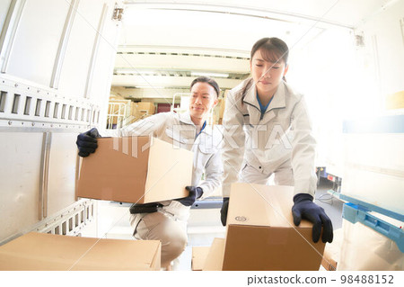 Staff loading/unloading luggage Transportation Logistics Business image 98488152