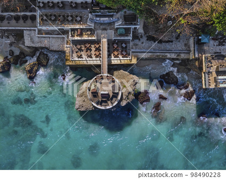 Aerial view of cafe at ocean coastline Aerial view of cafe at ocean coastline 98490228