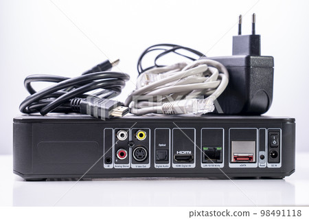 TV set-top box prepared for installation, digital TV kit on white background close-up with reflection 98491118