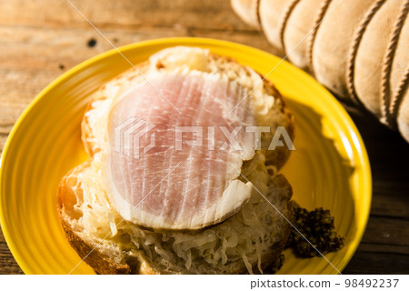 Ham and sauerkraut open sandwich 98492237