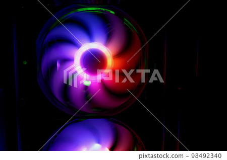 Colorful bright rainbow led rgb pc fan air case cooler. Computer chassis. Gaming modding, technology concept and IT background. 98492340