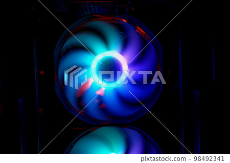Colorful bright rainbow led rgb pc fan air case cooler. Computer chassis. Gaming modding, technology concept and IT background. Colorful bright rainbow led rgb pc fan air case cooler. Computer chassis. Gaming modding, technology concept and IT background. 98492341