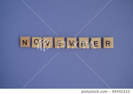 Eleventh month of the year November - from isolated letters on wooden blocks in natural color, in high resolution. Very Peri Color of the Year background, copy space. Flat lay, step by step, step 11 98492810