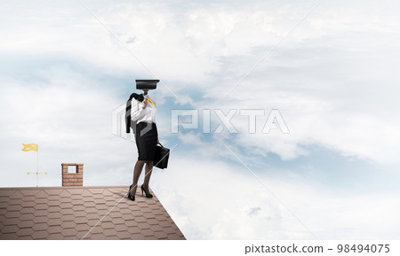 Concept of security and privacy protection with camera headed woman Concept of security and privacy protection with camera headed woman 98494075