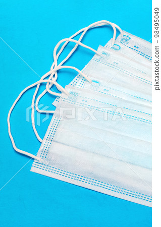Medical face masks on a blue background 98495049