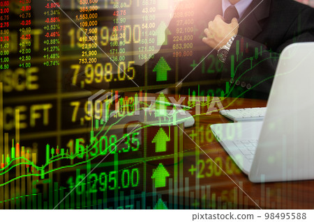 Stock market or forex trading graph and candlestick chart suitable for financial investment concept. Economy trends background for business idea and all art work design. Abstract finance background.. Stock market or forex trading graph and candlestick chart suitable for financial investment concept. Economy trends background for business idea and all art work design. Abstract finance background.. 98495588