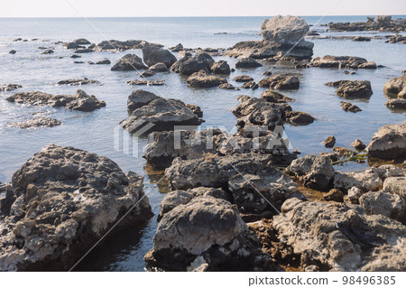 Rocks on beach in the morning, calm and natural background Rocks on beach in the morning, calm and natural background 98496385