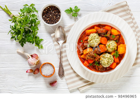 Beef Stew with Dumplings in bowl, top view 98496965