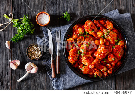 chicken stew with mushrooms in a tomato sauce 98496977