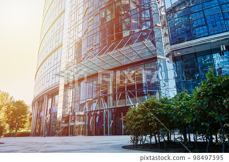 Modern city architecture, Skyscraper glass facade with green tree, Business administrative building Modern city architecture, Skyscraper glass facade with green tree, Business administrative building 98497395