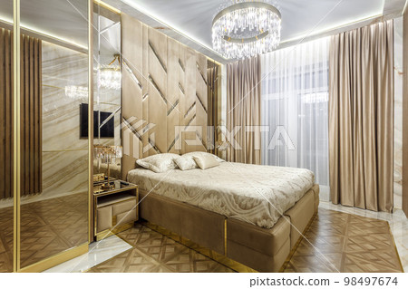 Luxury bedroom interior with parquet and mirror walls Luxury bedroom interior with parquet and mirror walls 98497674