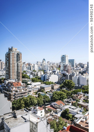 View of Buenos Aires from above. Cityscape architecture, houses and roofs of areas of Buenos Aires, Argentina. View of Buenos Aires from above. Cityscape architecture, houses and roofs of areas of Buenos Aires, Argentina. 98498148