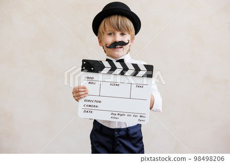 Child pretend to be a director 98498206