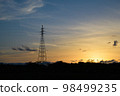 The sky dyed in the sunset and the transmission tower 98499235