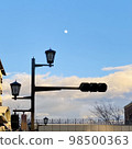 The moon, the clouds, the street lights, and the traffic lights that have disappeared 98500363