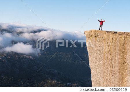 Guy on the Rock Preikestolen, Norway Guy on the Rock Preikestolen, Norway 98500629