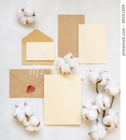Blank cards and envelope with cotton flowers top view on white, wedding mockup 98501809