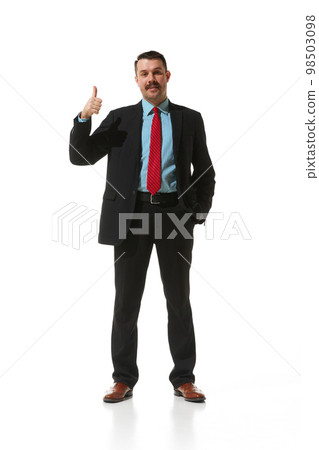 Businessman in a suit showing gesture of approvement and positivity over white studio background. Good. Concept of business, career, innovations, ad Businessman in a suit showing gesture of approvement and positivity over white studio background. Good. Concept of business, career, innovations, ad 98503098