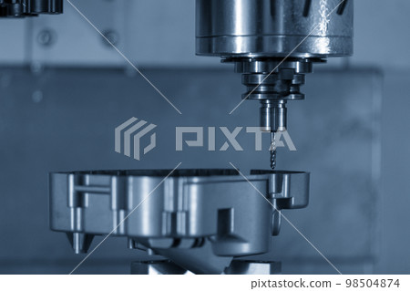 The CNC milling machine tapping process at automotive aluminum part. 98504874