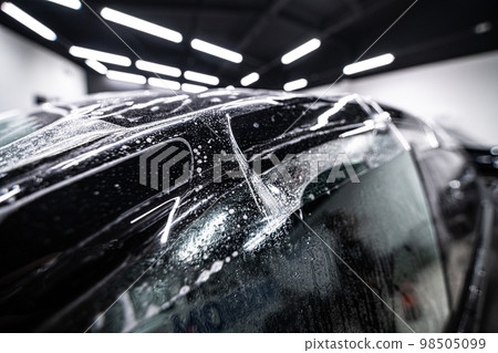 Colorless protective ppf film on the roof of a modern car. 98505099