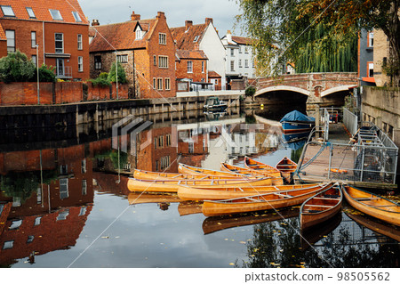 Houses and boats on the river Yare at Norwich city centre in Norfolk in autumn. Townhouses Buildings At Waterfront. Suburb Houses And Residential Building Near River In Europe. Selective focus Houses and boats on the river Yare at Norwich city centre in Norfolk in autumn. Townhouses Buildings At Waterfront. Suburb Houses And Residential Building Near River In Europe. Selective focus 98505562