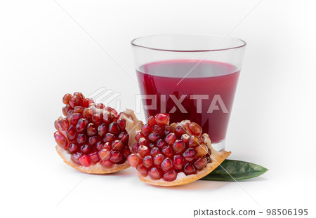 Pomegranate juice with pomegranate isolated on a white background Pomegranate juice with pomegranate isolated on a white background 98506195