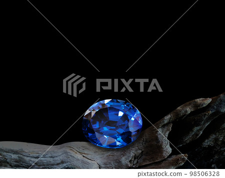blue sapphire on old wooden with black background blue sapphire on old wooden with black background 98506328