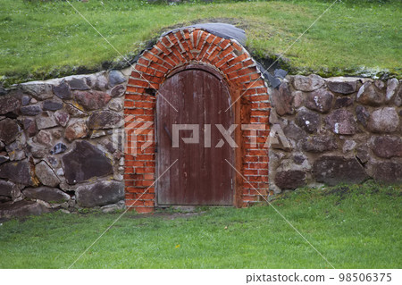 Historic brick door to a cave or dungeon. Historic brick door to a cave or dungeon. 98506375