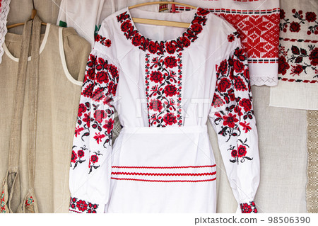 Embroidered national Belarusian dress. Slavic national women's clothing. Embroidered national Belarusian dress. Slavic national women's clothing. 98506390