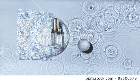 Cosmetic spa medical skincare, glass serum bottle in petri dish with collagen on blue water background with waves. 98506579