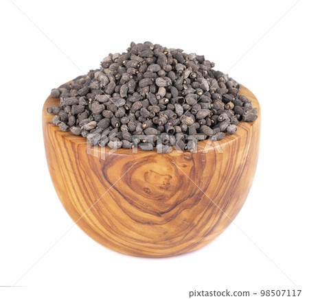 Borage seeds in wooden bowl, isolated on a white background. Borago officinalis seeds. 98507117