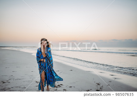 Young woman enjoying time at sea. Young woman enjoying time at sea. 98507635